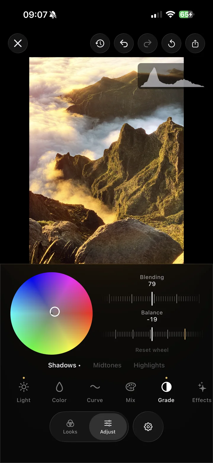 The Iris three-way grading wheels over a mountain photo